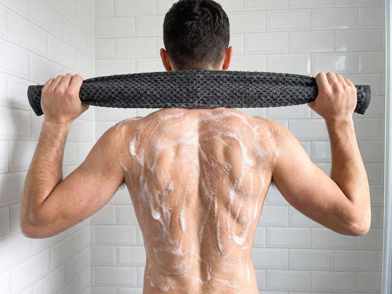 2 · Hold both ends and pull across your back